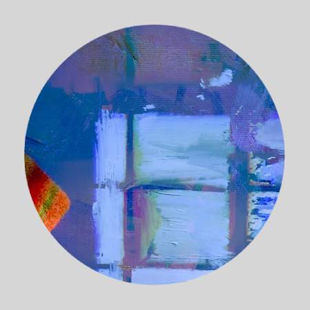 A circle with some blue and white painting on it