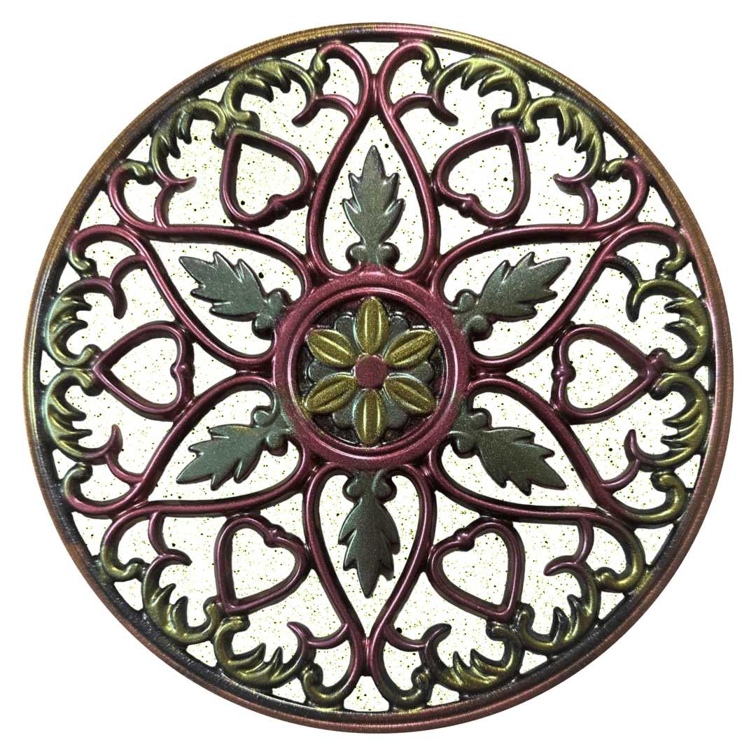 A round decorative metal work piece with green and red designs.
